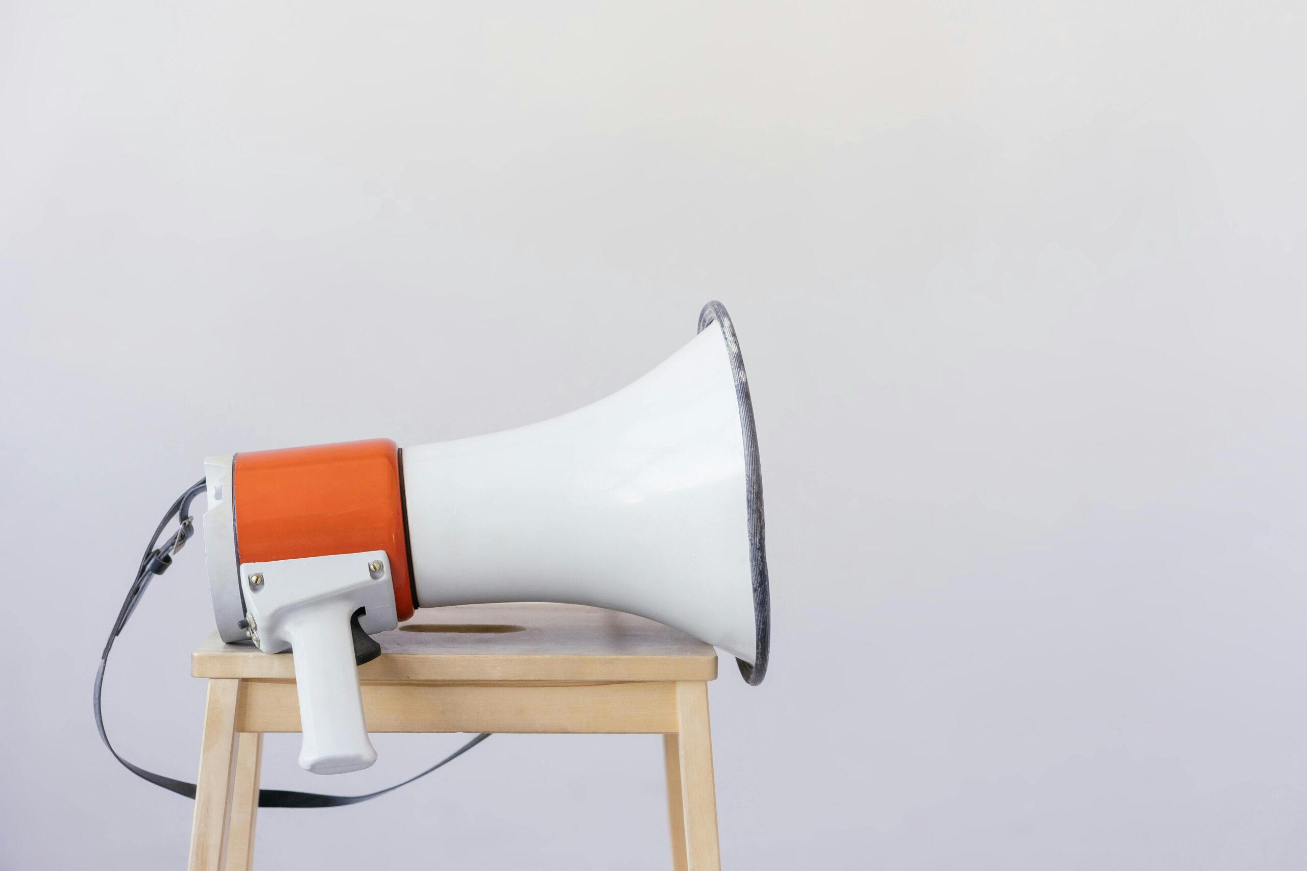 Image of an orange megaphone lying on a bench