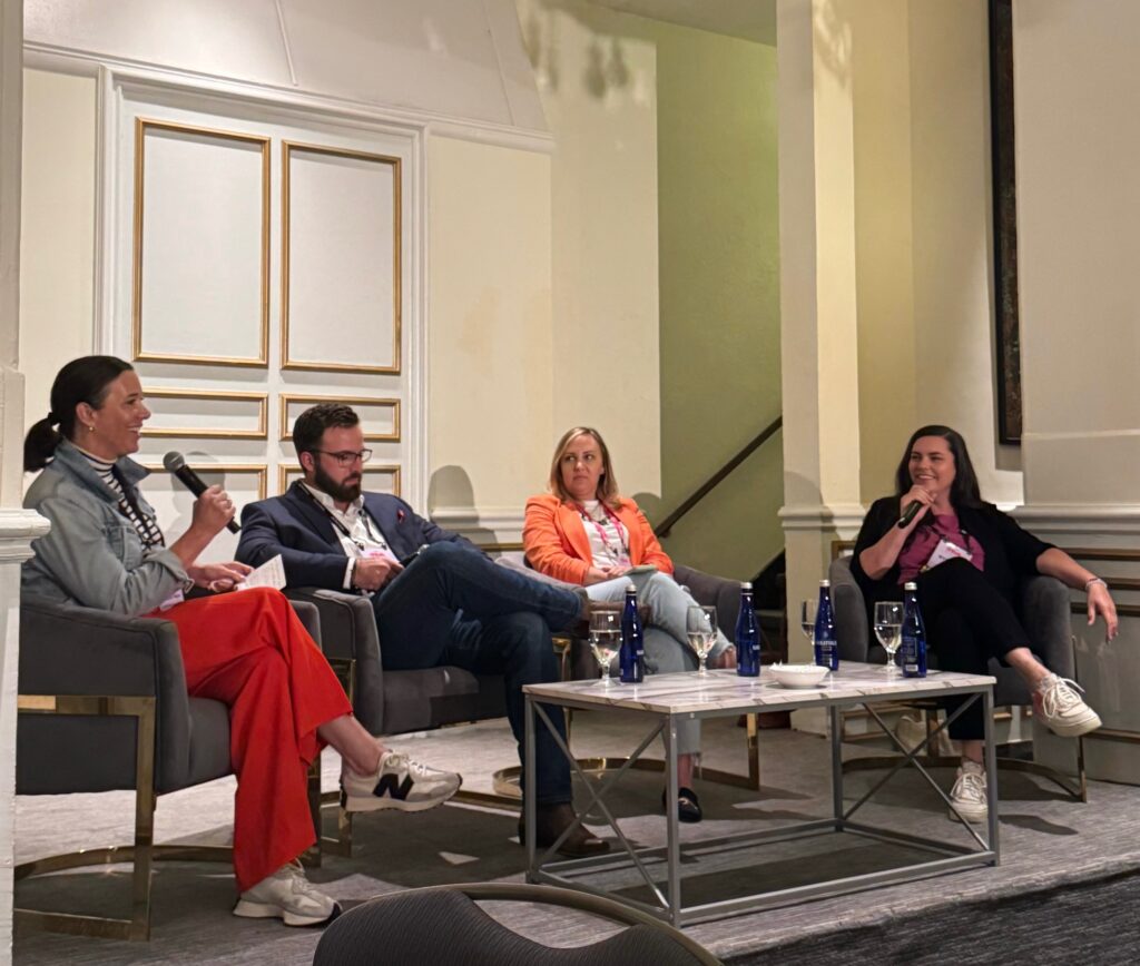 Panelists seated and engaged in conversation