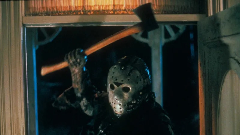 Image of a man (Jason from Friday the 13th) wearing a hockey mask and wielding an axe menacingly.